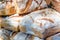 Assortment of different types of breads for sale on the market.