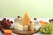 Assortment of different varieties of cheeses, grapes and nuts, fruits, the basis of the French diet, healthy and natural food