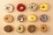 Assortment of donuts on orange background