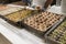 Assortment of eastern treats for lunch at a luxury resort in Antalya. Staff in gloves serving Turkish baklava for tourists at all-