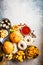 Assortment of fast food. Junk food background. Cheeseburgers, french fries, nachos, donuts, soda and nuggets on gray background,