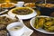 An assortment of Filipino cuisine on a wood table at a local restaurant. Included food are Calamares and Mussels, among other