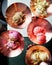 Assortment of flavored ice cream in copper bowls, top view