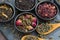 Assortment of fragrant dry tea in ceramic bowls, top view