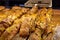 Assortment of french fresh baked sweet puff pastry in confectionery shop