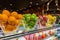 Assortment of fresh fruits in glass bowls in restaurant