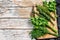 Assortment of fresh herbs coriander, rosemary, thyme, dill, parsley. A bunch of fresh condiments. White background. Top view. Copy