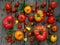 Assortment of fresh organic colorful tomatoes on wooden background.