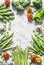 Assortment of fresh organic vegetables with copy space on a light background, top view. Asparagus, broccoli, green beans, peas, be