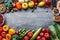 Assortment of fresh vegetables and fruits on wooden table in frame. Generative AI