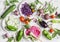 Assortment of fresh vegetables on a light background - zucchini, eggplant, peppers, beets, tomatoes, green beans, red cabbage.