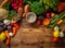Assortment of fresh vegetables on wooden background