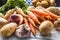 Assortment of fresh vegetables on wooden table. Carrot parsnip garlic celery onion and kohlrabi