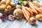 Assortment of fresh vegetables on wooden table. Carrot parsnip garlic celery onion and kohlrabi