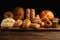 Assortment of freshly baked bread on wooden table