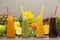 Assortment of fruit and vegetables smoothies in glass bottles. Fresh organic Smoothie ingredients. Detox, dieting or healthy food