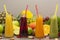 Assortment of fruit and vegetables smoothies in glass bottles. Fresh organic Smoothie ingredients. Detox, dieting or healthy food