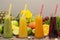 Assortment of fruit and vegetables smoothies in glass bottles. Fresh organic Smoothie ingredients. Detox, dieting or healthy food