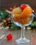 Assortment of glazed fruits in a glass close up. Traditional spanish glazed fruit on the Christmas background