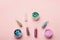 Assortment of glitters for nail design on pink background, top view