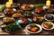 Assortment of gourmet non-vegetarian dishes displayed on a rustic wooden table, highlighting the sizzling flavors