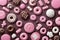assortment of gourmet white, dark and milk chocolates with pink icing on a brown chocolate background. Sweets background. photo