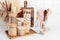 Assortment of grains, cereals and pasta in glass jars and kitchen utensils on wooden table