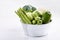 Assortment green vegetables on white table.  Broccoli, cauliflower, brussels sprouts, kohlrabi, avocado, asparagus. Healthy eating