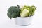 Assortment green vegetables on white table.  Broccoli, cauliflower, brussels sprouts, kohlrabi, avocado, asparagus. Healthy eating