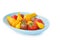 Assortment of heirloom cherry tomatoes in blue bowl isolated