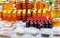 Assortment of honey jars at market stall. Sale of natural honey in fair outdoor