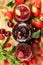 Assortment of jams, seasonal berries, cherry, mint and fruits in glass jar