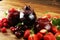 Assortment of jams, seasonal berries, cherry, mint and fruits in glass jar