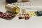 An assortment of Medicine pills and capsules on white background.