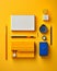 an assortment of office supplies on a yellow background