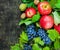 Assortment organic fruits berries apple grape damascene walnut dark wooden country background health care natural