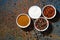 assortment of pepper, different spices and sea salt in bowl