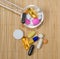 Assortment of pharmaceutical preparations, tablets and capsules on a spoon, on a bamboo mat