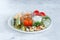 Assortment plate of pickled vegetables, chopped marinated mushrooms, cucumbers, tomatoes