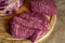 Assortment of raw beef on wooden chopping board