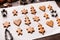 Assortment of raw gingerbread cookies and metal cutters