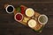 Assortment of sauces, ketchup, mayonnaise, cheese, soy, green, on a cutting board, with ingredients, top view, no people