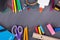 Assortment of School Supplies on a Chalkboard Background