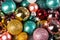 Assortment of shiny multi colored christmas balls..