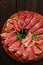 Assortment , sliced meat appetizer, prosciutto, salami and ham, with olives, breakfast, top view, close-up, no people,