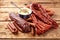 Assortment of spicy dried sausages with mustard