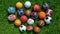 Assortment of sport balls on green grass Generative AI