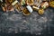 Assortment of sprats in oil. Smoked fish On a black background. top view.