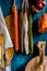 Assortment of traditional Spanish charcuterie meat sausages, kitchen utensils, towel, wood cutting board, rustic