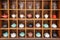 assortment of various ceramic and glass teapots on the cabinet as an interior decoration at home or in a cafe
